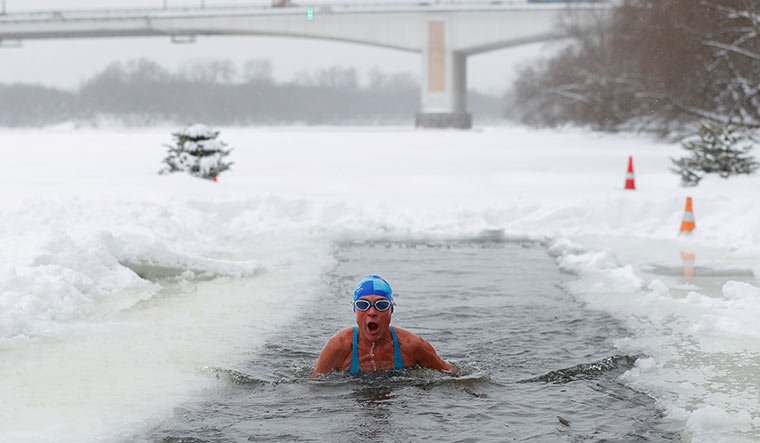 A member of a winter swimming club bathes in icy waters in Moscow